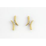 A pair of 9ct yellow gold (stamped 9ct) diamond set stud earrings, L. 1.5cm.