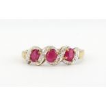 A 9ct yellow gold ruby and diamond set ring, (N).