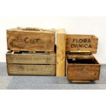 A group of four advertising crates and a brass handled crate, largest 53.5 x 36.5 x 26.5cm.