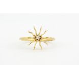 A yellow metal (tested minimum 9ct gold) ring set with a brilliant cut diamond, (L).