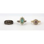 A 9ct yellow gold stone set cluster ring, a 925 silver stone set cluster ring and a gold and
