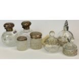 A collection of four hallmarked silver scent bottles, together with three decorative scent bottles.