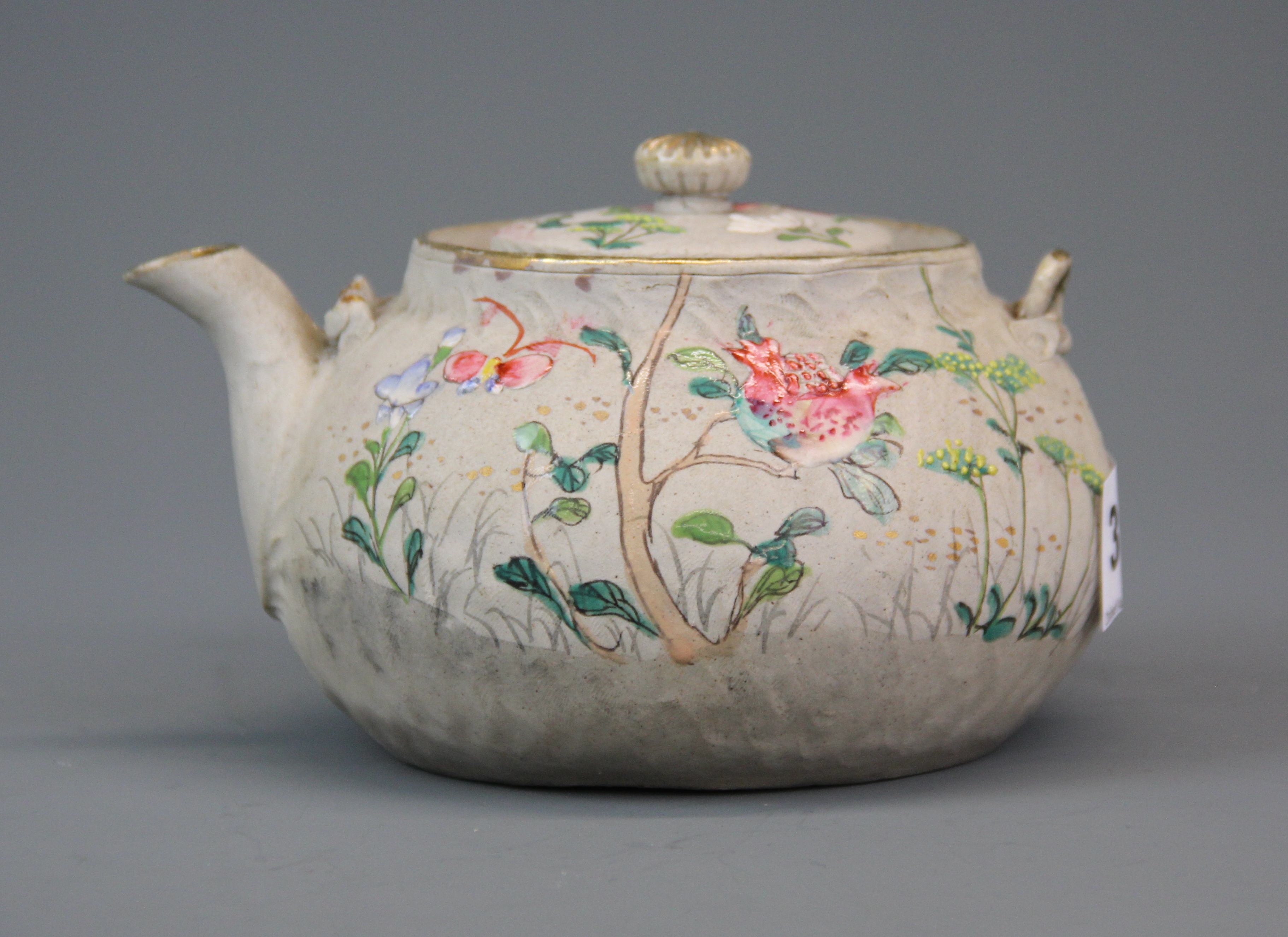 An early 20th Century Chinese enamelled grey pottery tea pot, L. 14cm. H. 9cm.