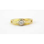 A hallmarked 18ct yellow gold diamond set solitaire ring, (O.5).