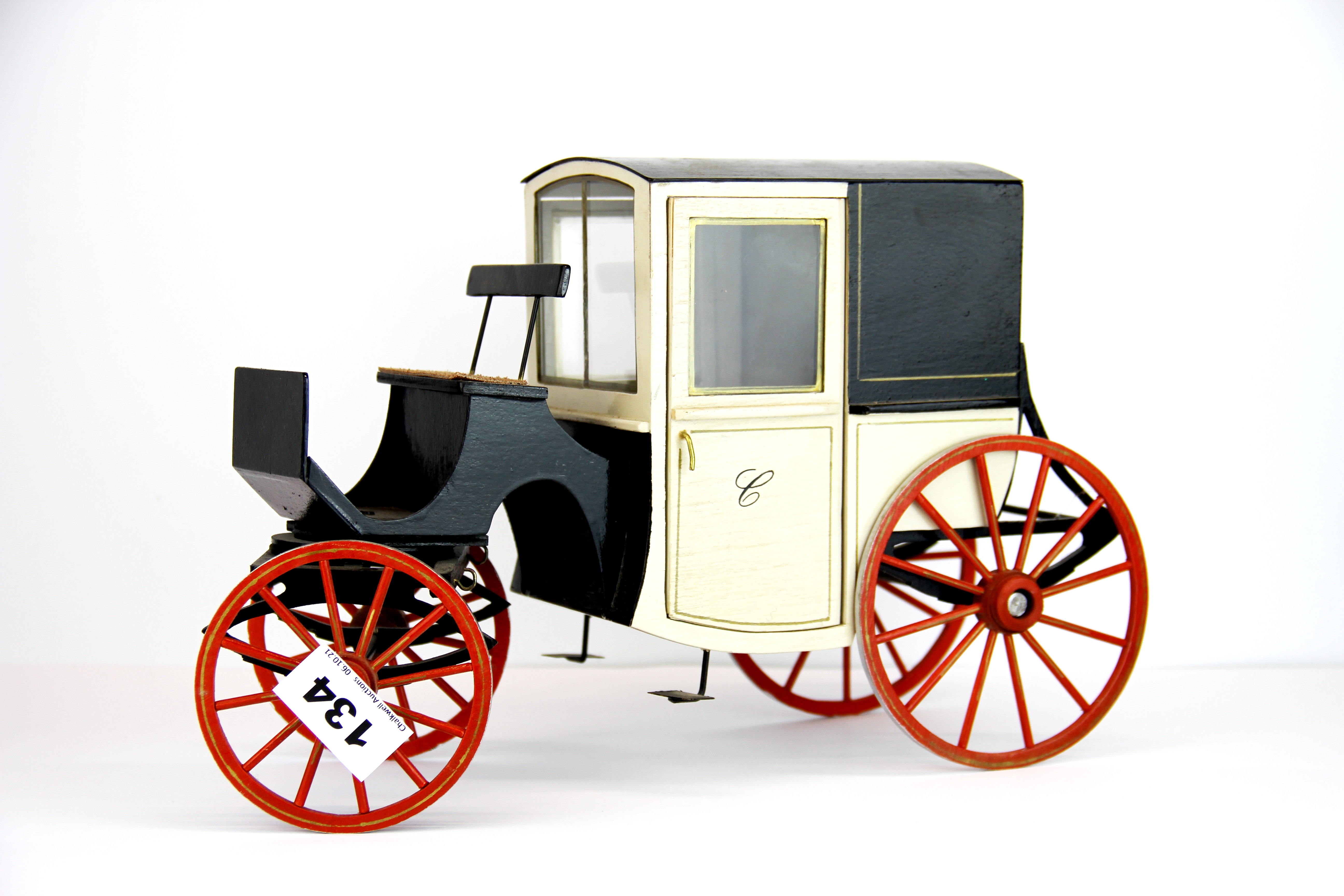 A dolls house carriage, L. 31cm.