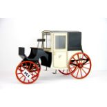 A dolls house carriage, L. 31cm.