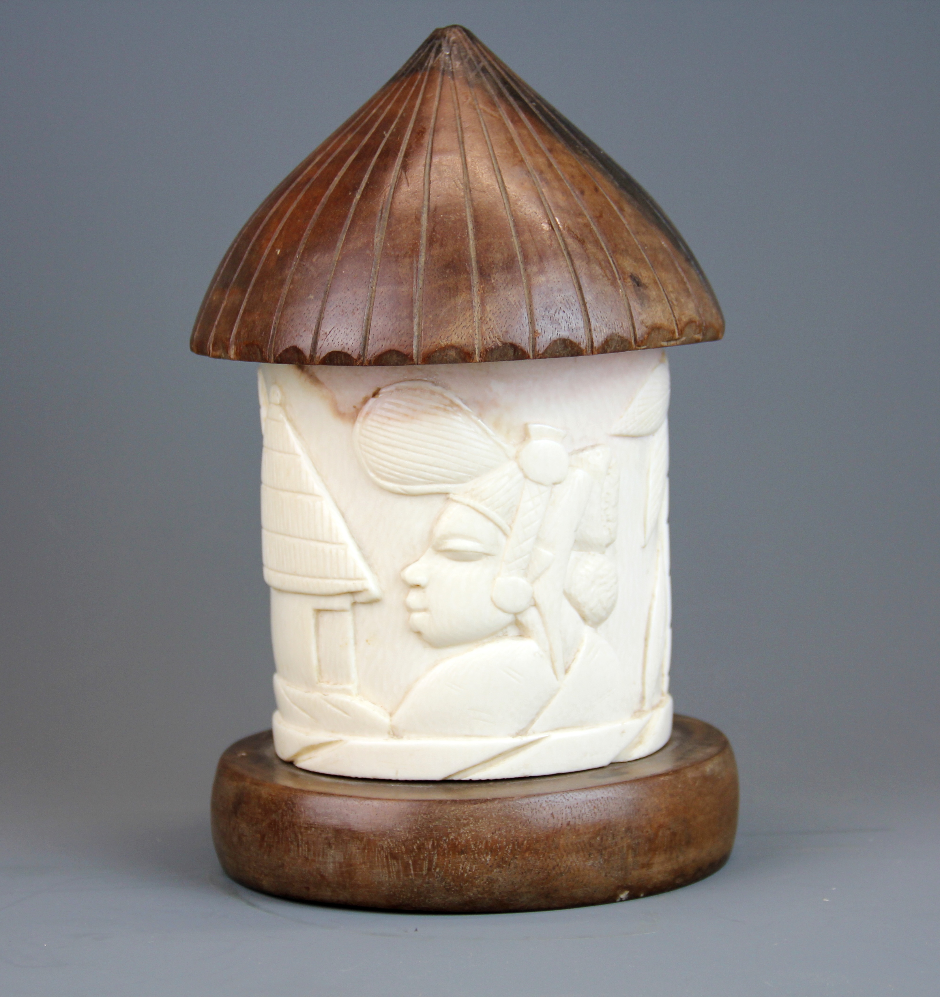 An early 20th Century African carved ivory and hardwood box in the shape of a tribal hut, H. 23cm. - Image 2 of 2