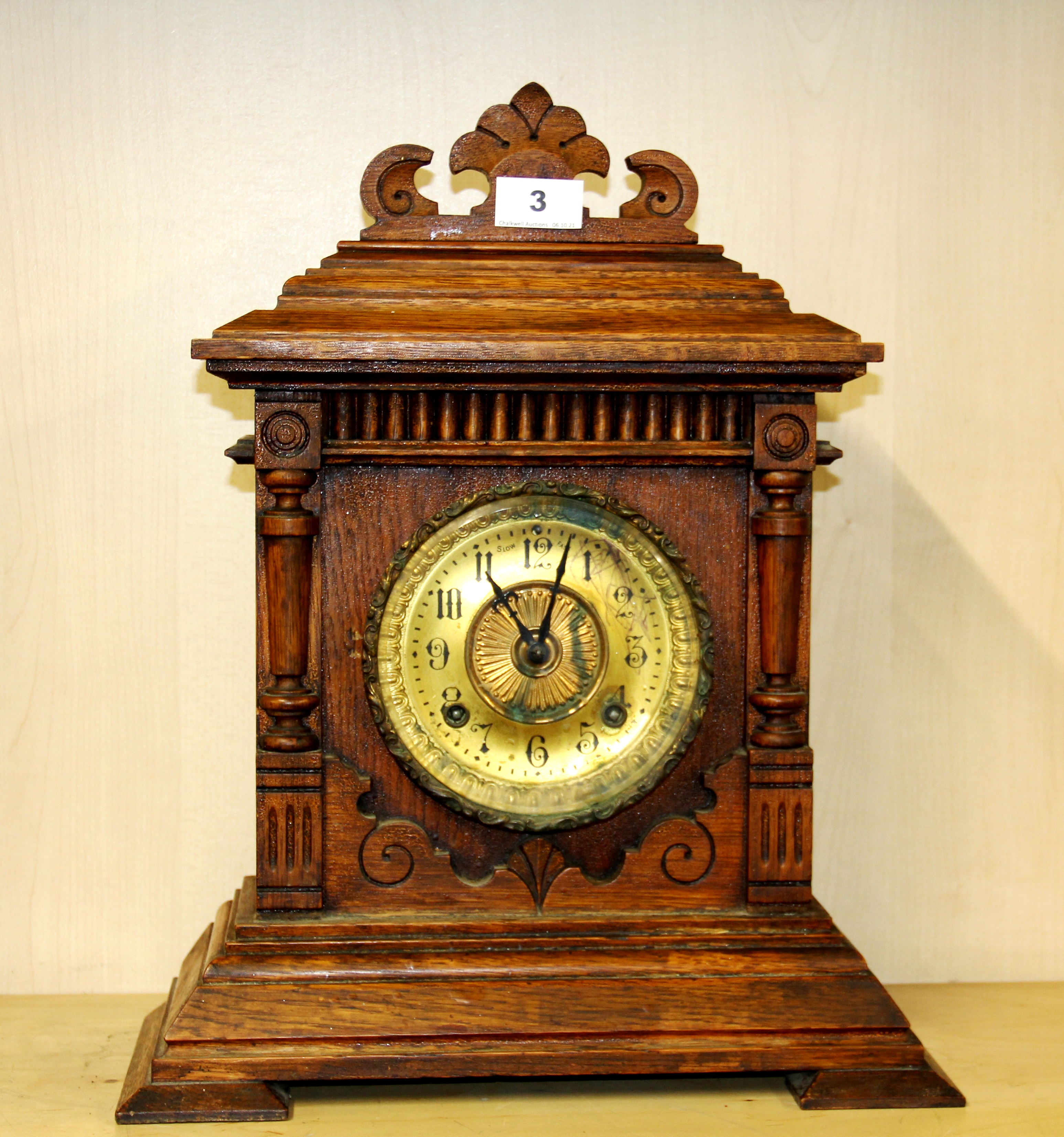 A carved oak American Ansonia 8 days Sharon striking mantle clock , H. 43cm.