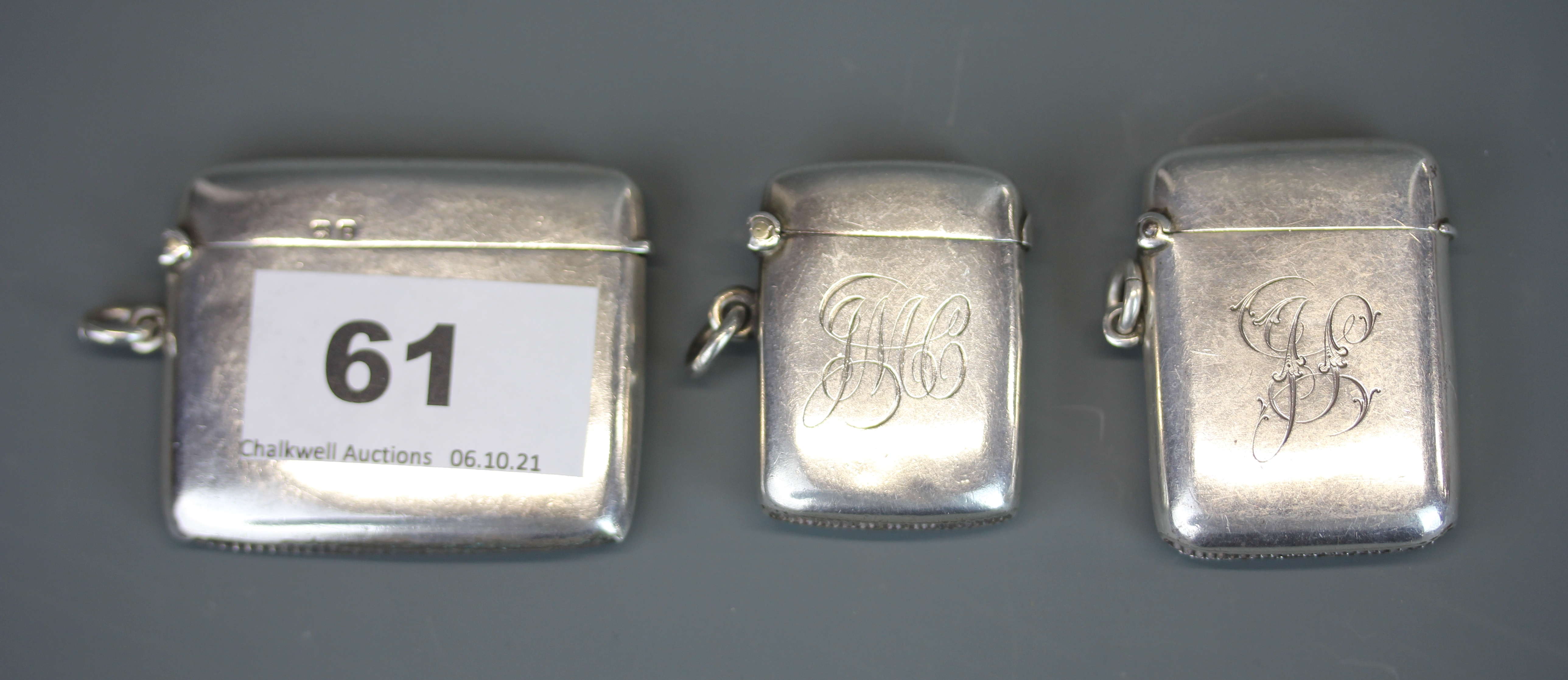 Two Chester hallmarked silver vesta cases and a further hallmarked silver case.