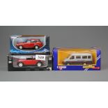 Three boxed die cast model vehicles.