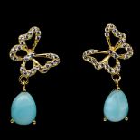 A pair of 925 silver gilt drop earrings set with pear cabochon cut larimar and white stones, L. 2.