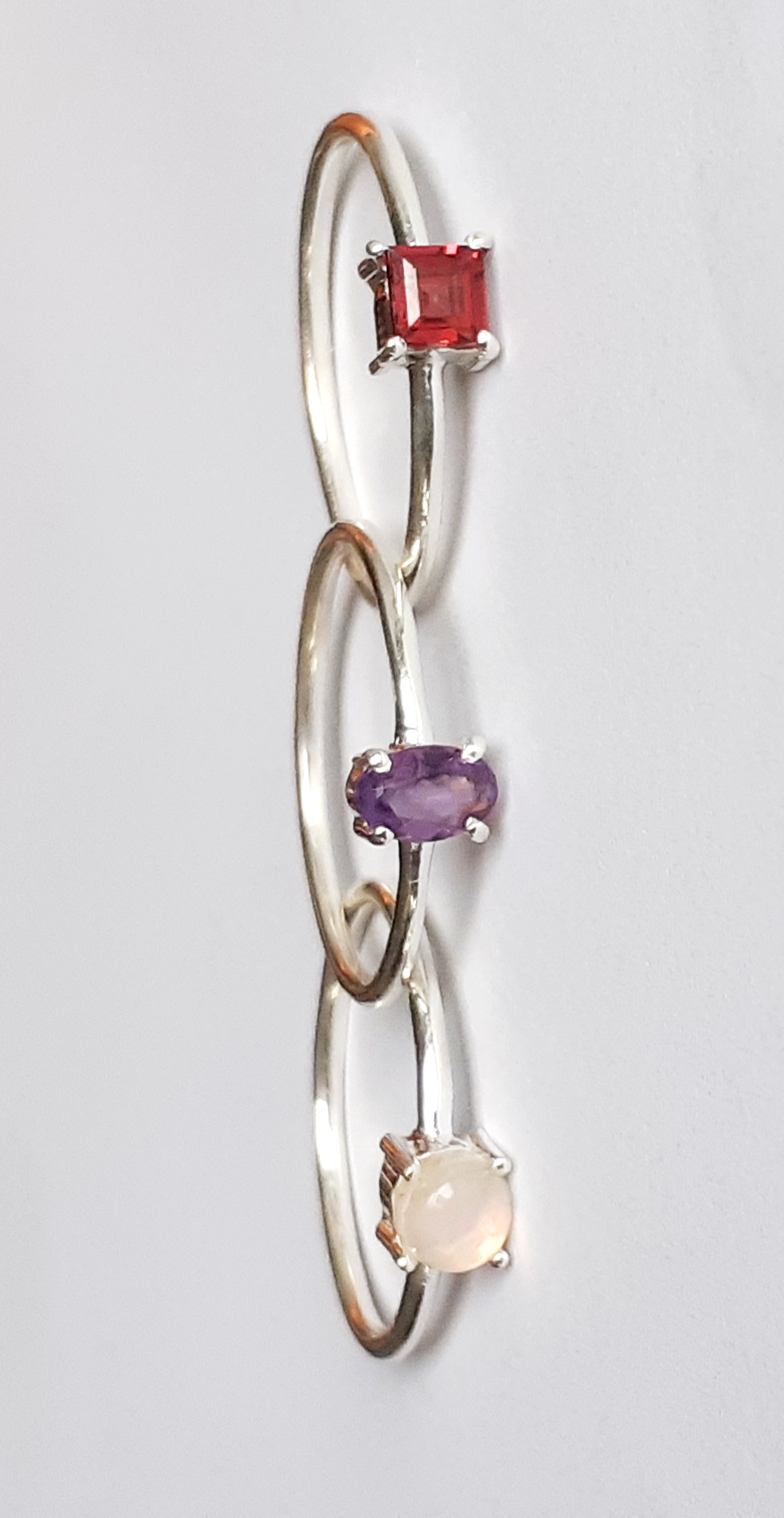 Three 925 silver stacking rings set with opal, amethyst and garnet, (S). - Image 2 of 2