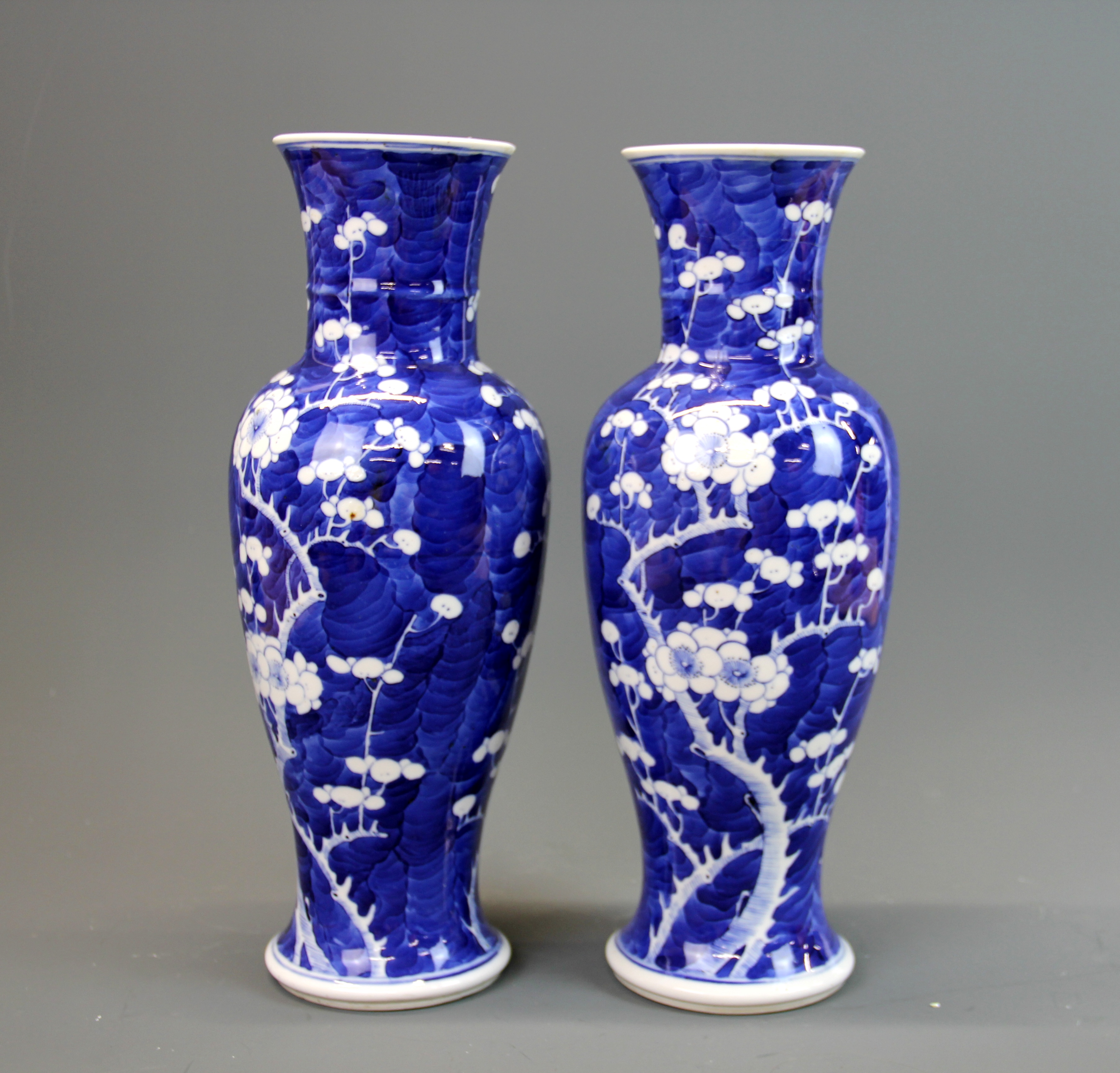 A pair of 19th century Chinese prunus pattern porcelain vase with four character mark to base (A/F),