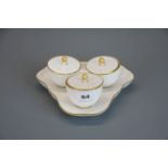 A Sevres white porcelain three fixed bowl sweet meat dish with lids, W. 21cm.