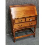 A 1930's mahogany bureau, H. 97cm, W. 66cm.