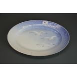 A Royal Copenhagen oval meat plate decorated with seagulls, W. 40cm.