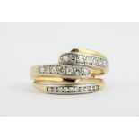 An 18ct yellow and white gold ring set with brilliant cut diamonds, (Q).