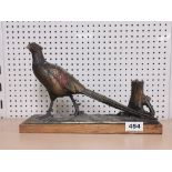 A cold painted spelter pheasant strike lighter, L. 31cm. H. 21cm. A/F to tail.
