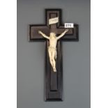 A 19th century carved ivory and ebony crucifix, H. 40cm.