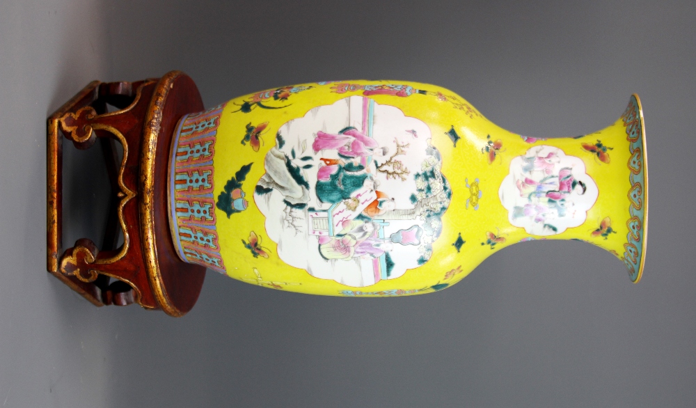 An 18th/early 19th century Chinese Famille Jaune and Canton enamelled porcelain vase, H. 44cm. On