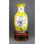 An 18th/early 19th century Chinese Famille Jaune and Canton enamelled porcelain vase, H. 44cm. On