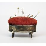 A hallmarked silver pin cushion, L. 5.5cm.