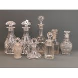 Two Georgian cut glass decanters, a pair of Victorian decanters and a pair of cut crystal