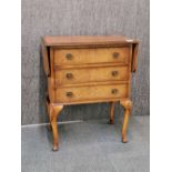 A walnut veneered three drawer drop leaf side table, H. 73cm, extended L. 98cm.