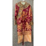 A Chinese silk robe, L. 130cm. Slight wear to collar and cuffs otherwise sound.