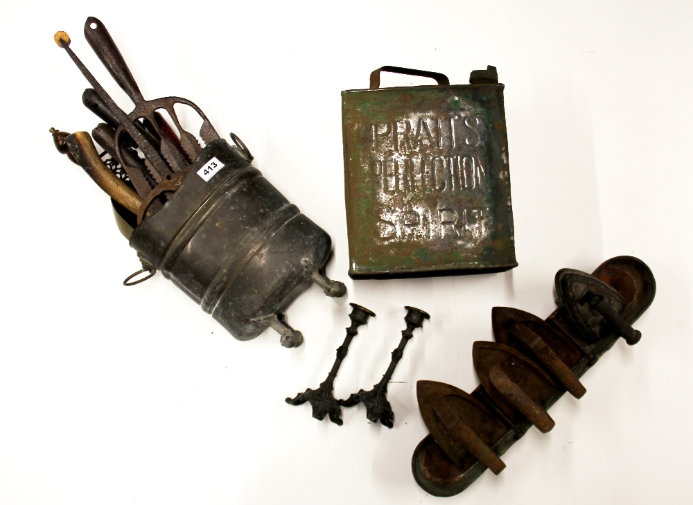 A quantity of cast iron and other metalware items.