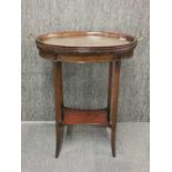 An Edwardian mahogany serving table with lift off glass bottomed tray , H. 72cm.