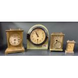 An interesting ships port hole clock, H. 20cm. and three others.