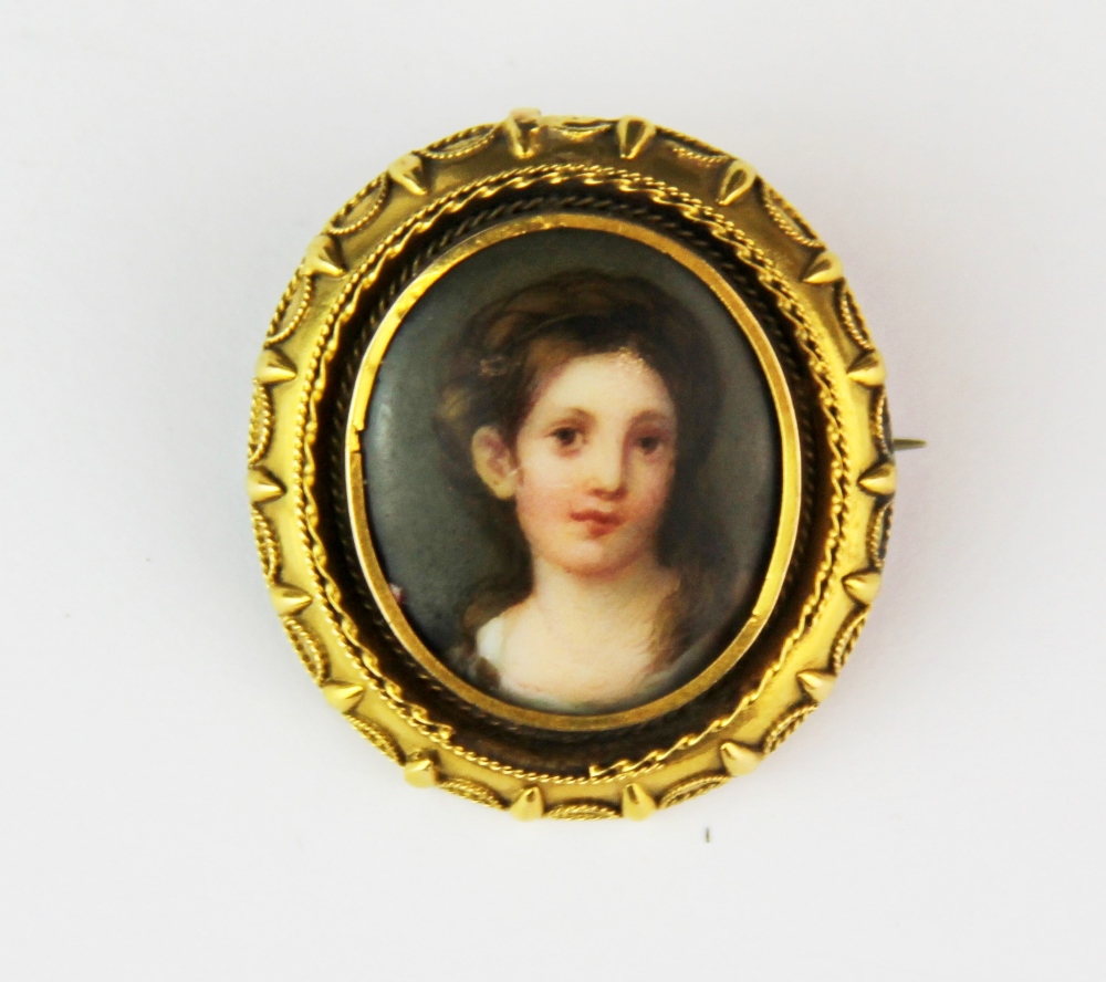 A 19th century yellow metal mounted hand painted porcelain portrait miniature set as a brooch, L.