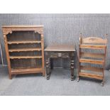 A carved oak bookcase, 106 x 77cm. together with a further oak bookcase and a side table.