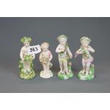 A group of four early English porcelain figures of Putti, H. 11.5cm. Some restoration.