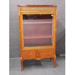 A fine French ormolu mounted kingwood veneered display cabinet with top and bottom drawers, H.
