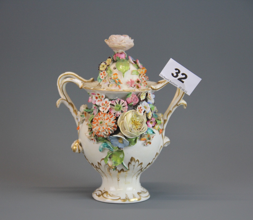 An 18th century porcelain potpourri and cover (possibly Coalbrookdale), H. 18cm.