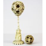 A 19th Century Chinese carved ivory concentric dragon ball on stand together with a further