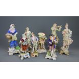 A group of eight 19th century continental porcelain figurines, tallest 24cm. Some damage and