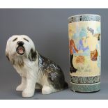 An Oriental glazed porcelain umbrella stand and a large porcelain dog, tallest 46.5cm.