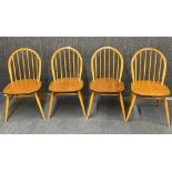 A set of four Ercol dining chairs.