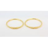 A pair of 22ct yellow gold (stamped 916) bangles, Dia. 7.2cm.