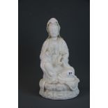 A large unglazed Chinese white porcelain figure of the goddess Guanyin, H. 39cm.