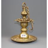 An early Nepalese bronze hanging oil lamp and chain, Dia. 18.5cm. H with chain. 63cm.