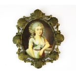 A 19th century hand painted portrait miniature of a young woman initialled M., L. 15cm.
