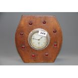 A 'jewel' inset re-used propeller centre mantle clock with Smiths movement, H. 23cm.