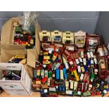 A large quantity of boxed and unboxed die cast vehicles.