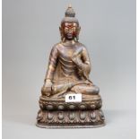 A Sino-Tibetan hand painted and gilt grey metal figure of a seated Buddha, H. 29cm.