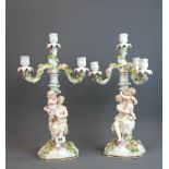 A pair of 19th century German porcelain candelabra, H. 48cm.