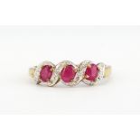 A 9ct yellow gold ruby and diamond set ring, (N).